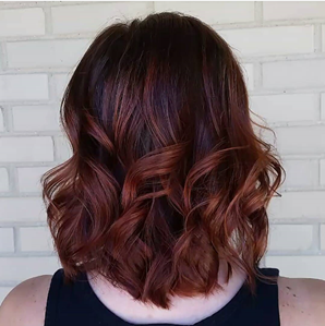 Auburn curled hair